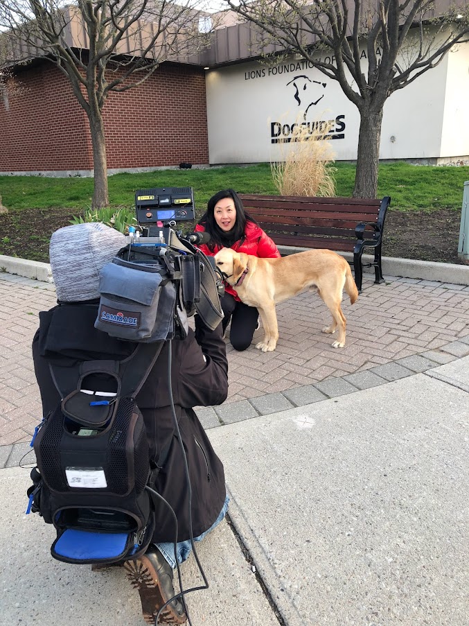 News reporter with Dog Guide